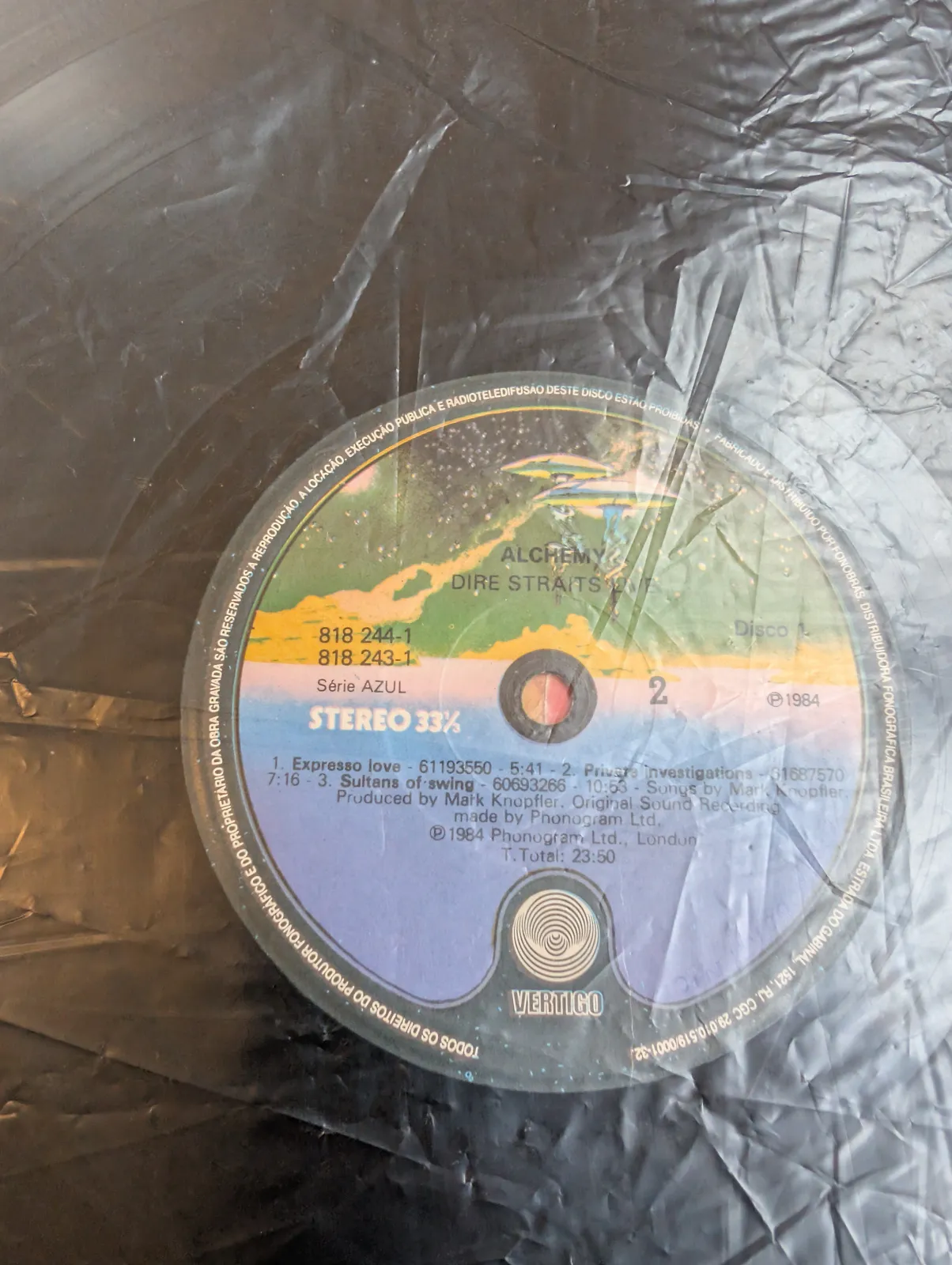 Dire Straits — Alchemy, label-b