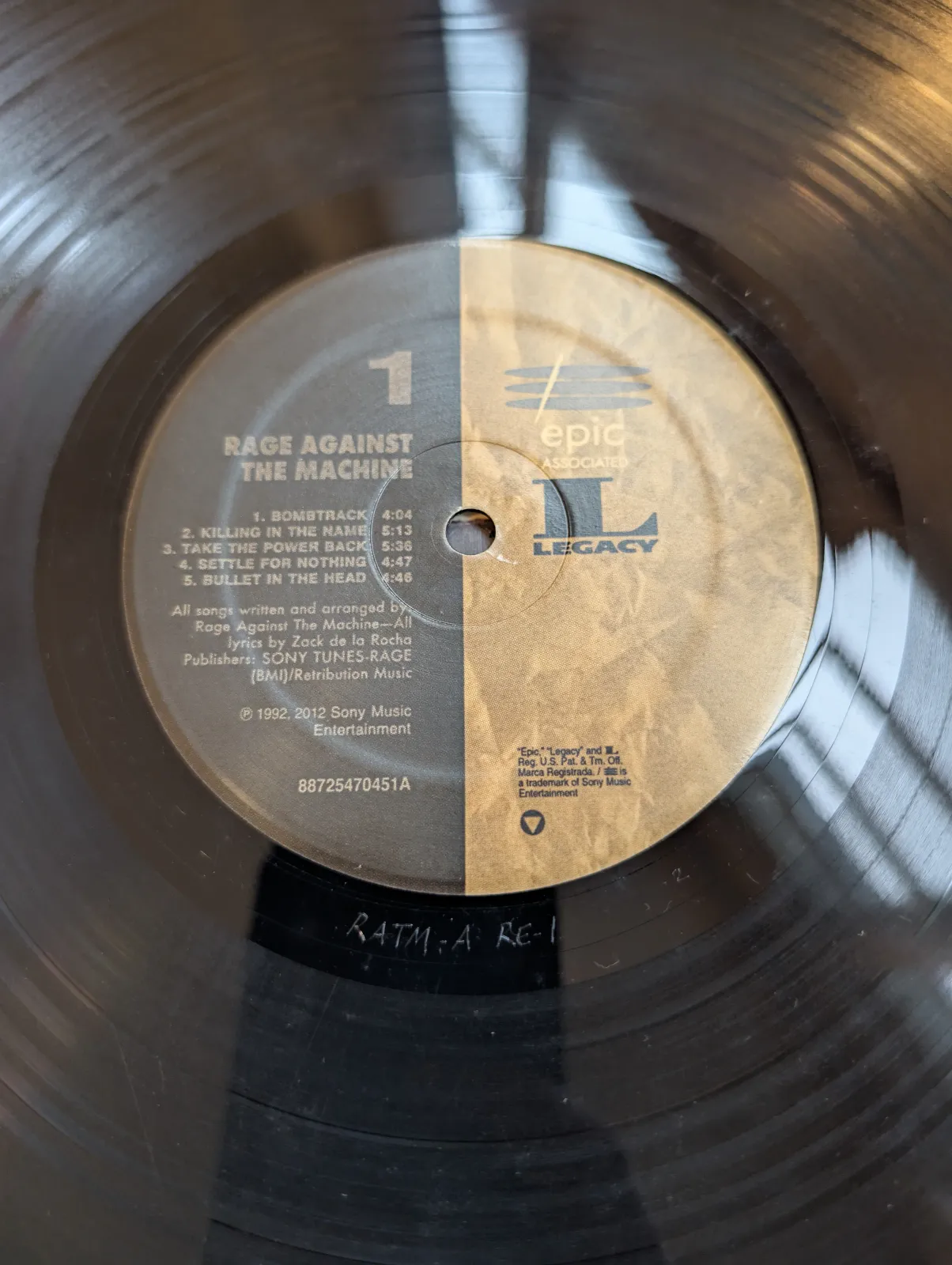 Rage Against the Machine — Rage Against the Machine, label-a